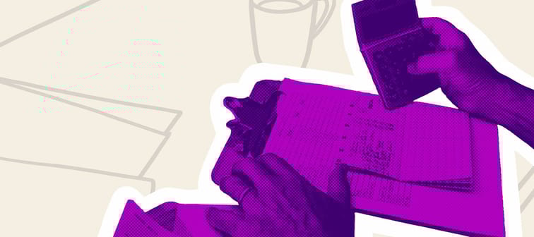 Hands of homeowner balancing the budget while drinking coffee in daily routine in home sweet home.