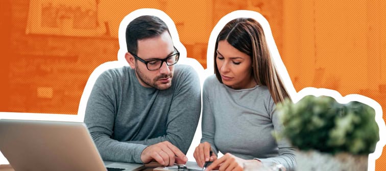 Couple doing finances at home.