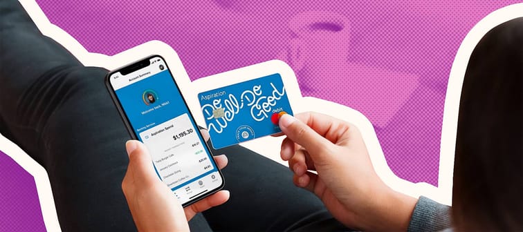 person holding phone using Aspiration app