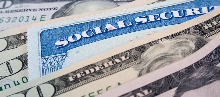 Social security card and American money dollar bills close up concept