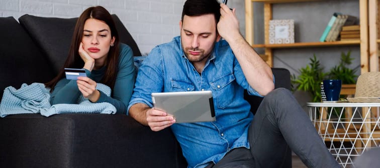 Young couple at home having financial difficulties