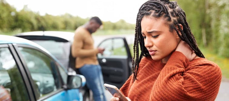 Female Motorist Involved In Car Accident Calling Insurance Company Or Recovery Service