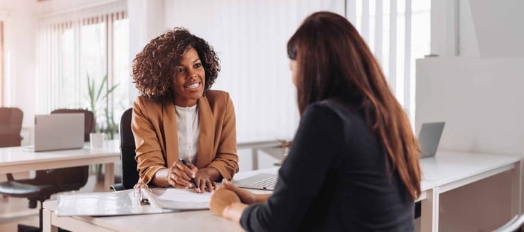 Woman consulting with a female financial manager at the bank