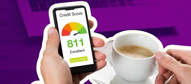 Close-up Of A Businessman Checking Credit Score Online On Cellphone While Having Coffee