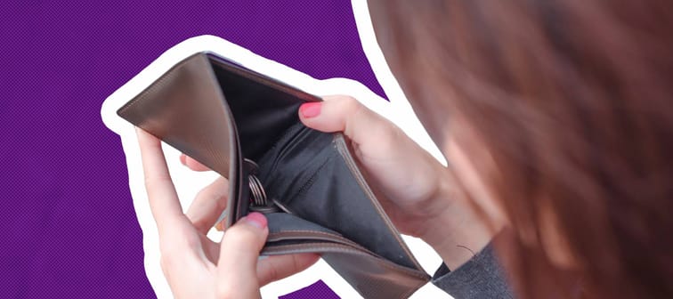Unhappy bankrupt woman with empty wallet . Young woman shows her empty wallet. Bankruptcy