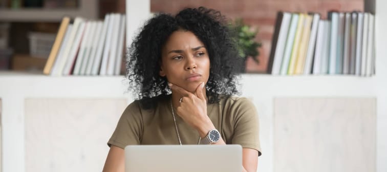 Woman pondering credit score